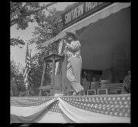 Worm's-eye view of Leo Carrillo addressing the Southern Pacific Railroad employee picnic, Los Angeles, 1945