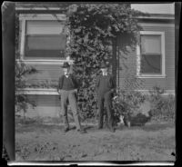 James Pirie and Wayne West pose next to the West's house, Los Angeles, about 1900