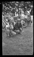 Sammy Lee and Al Brokate kneel in front of spectators at the Trailer Coach Association of California rally, Ventura, 1948