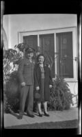 PFC H. H. West, Jr. and Anna Roth pose in front of H. H. West's residence, Los Angeles, 1944