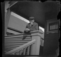 George M. West stands on the front porch of the West's house, Los Angeles, about 1900