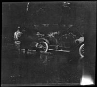 H. H. West's Buick gets stuck in Big River, Mendocino County, 1915