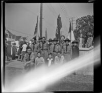 Richard Siemsen poses with Boy Scout Troop no. 76 outside Asbury Methodist Church, Los Angeles, 1943