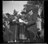 Alice Baltzell Tibbetts, Leta French, and William Biddick stand together at the Iowa Picnic in Lincoln Park, Los Angeles, 1939