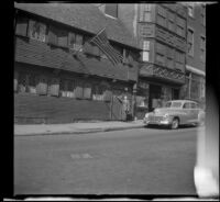 H. H. West knocks on the door at the Paul Revere House, Boston, 1947