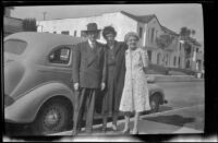 Wayne West, Maud West and Mertie West pose next to Wayne West's car, Los Angeles, 1944