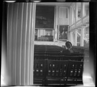 Mertie West sits in Faneuil Hall's Great Hall, Boston, 1947