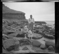 H. H. West stands on the beach at La Jolla with his daughters, Elizabeth and Frances, San Diego, 1909