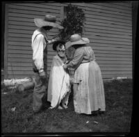 Lucy Mead and William Mead help costume Grace Biddick, Elliott vicnity, 1900