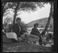 Hattie Cline and Elizabeth West lunch under the trees at Elizabeth Lake, Lancaster vicinity, about 1912