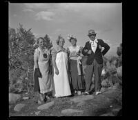 Agnes Whitaker, Josie Shaw, Mertie West and H. H. West posing in their "formal" attire, Mono County, 1941