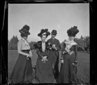 Daisy Connor, Lena Weideman, Ben Tyler, and Mary Dixon stand together in Lincoln (Eastlake) Park, Los Angeles, about 1900