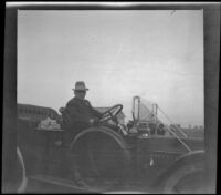 Mat Everhardy sits behind the wheel of his Stearns-Knight car, Orange County vicinity, about 1912