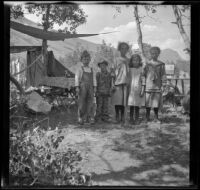 Lynn McClellan, Chester Schmitz, Elizabeth West, Irene Schmitz and Frances West posing at the Silver Lake campsite, June Lake vicinity, 1914