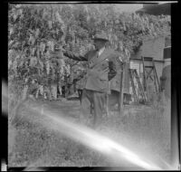 H. H. West stands in the backyard of 2223 Griffin Avenue, Los Angeles, 1942