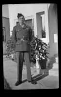 P.F.C. H. H. West, Jr. stands outside the West's residence while visiting on a 3-day pass, Los Angeles, 1944