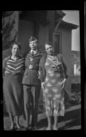 Elizabeth West Siemsen, H. H. West, Jr. and Frances West Wells pose for a photograph outside Elizabeth's house, Glendale, 1939