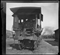 Wrecked Southern Pacific Railroad train engine sits on the tracks at River Station, Los Angeles, about 1898