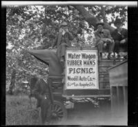 Attendees of the Rubber Men's Picnic sit atop the water wagon, Santa Monica Canyon, about 1908