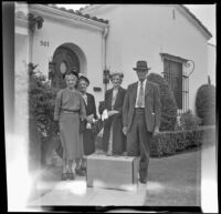 Mertie West, Zetta Witherby, Dode Witherby and Will Witherby pose outside Zetta and Dode Witherby's residence, Los Angeles, 1948