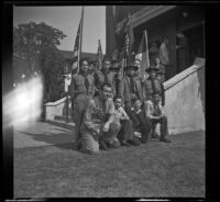 Richard Siemsen poses with Boy Scout Troop no. 76 in front of Asbury Methodist Church, Los Angeles, 1943