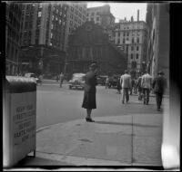 Mertie West looks towards the Old State House and site of the Boston Massacre, Boston, 1947