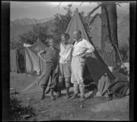 H. H. West Jr., Mertie West, and H. H. West pose together at a campsite, Inyo Couny vicinity, about 1930
