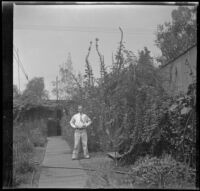 H. H. West Jr. stands in the West's backyard, Los Angeles, about 1932