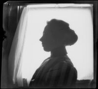 Nella A. West poses for a silhouette portrait, Los Angeles, about 1900