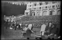 Mertie West lounges in chair in front of Chateau Lake Louise, Lake Louise, 1947