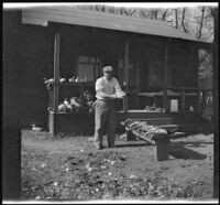 Keeper Jesse Shanklin cleaning ducks after a shoot, Gorman vicinity, circa 1910s