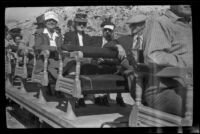 Mertie West, Dode Witherby, Zetta Witherby and Wes Witherby sit aboard a narrow gauge train at Ryan, Death Valley National Park vicinity, 1947