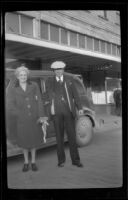 Mertie West and H. H. West pose in front of a car, Valdez, 1946