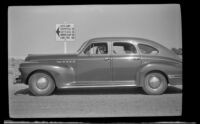 H. H. West's car travels through Death Valley with Wes Witherby driving, Death Valley National Park, 1947