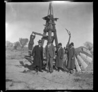 H. H. West, Jr., Abraham Whitaker, Forrest Whitaker, Mertie West and Agnes Whitaker posing by a windmill, Rosamund, about 1927