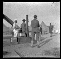 Soldiers stand around the camp set up at Agricultural Park, Los Angeles, 1900