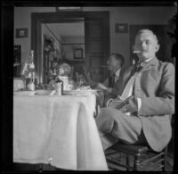 Wilhelmina West, Guy West, and H. H. Cooper sit around a table, Los Angeles, 1897