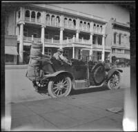 Wilfrid Cline, Jr. sitting in the backseat of H. H. West's parked Buick, Red Bluff, 1917