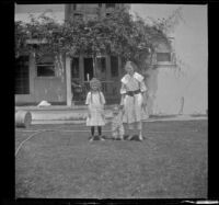 Tacoma and Lois Winkler hold H. H. West Jr.'s hands, Los Angeles, about 1918