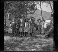 Lynn McClellan, Chester Schmitz, Elizabeth West, Irene Schmitz and Frances West posing in the Silver Lake camp, June Lake vicinity, 1914