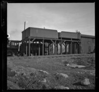 Two tenders up on posts at Crafton for fuel oil storage, Redlands vicinity, 1899