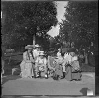 Members of the West and Schmitz families taking a break while visiting Balboa Park, San Diego, [about 1915]