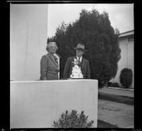 Josie Shaw and William H. Shaw stand by the wedding cake celebrating their 50th wedding anniversary, Alhambra, 1944