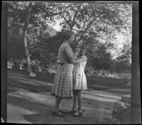 Eleanor Shaw hugs her grandmother, Josie Shaw in Victory Park, Los Angeles, 1931