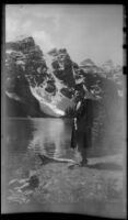 Mertie West poses by the edge of Moraine Lake, Banff National Park, 1947