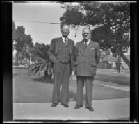 Arthur C. Crowell and J. E. Smith pose together on the front walkway outside J. E. Smith's home, Los Angeles, 1943