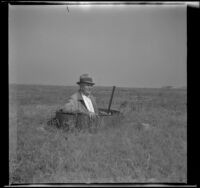 Al Schmitz waits in blind no. 3 at the Center Gun Club, [Orange County], 1943