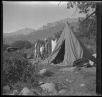 Agnes and Forrest Whitaker stand in front of Mertie West and H. H. West Jr., Inyo County, about 1930