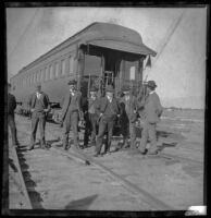 Southern Pacific Railroad employees pose in front of a train car, Salton Sea vicinity, about 1899