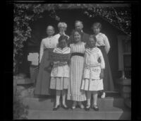 Members of the West and Cline families pose on the front porch steps of H. H. West's residence on South Harvard Boulevard, Los Angeles, about 1915